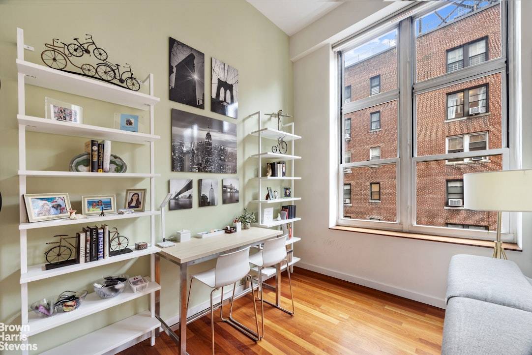 THE CHARM OF A LOFT, THE ELEGANCE OF PARK AVENUE COURT A dramatic duplex one bedroom home with double height ceilings and enormous south facing windows, providing wonderful light.
