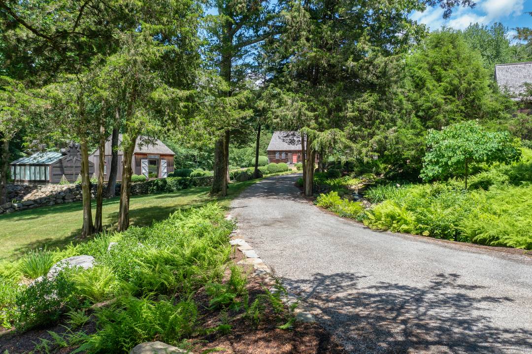 Located in the picturesque countryside of Lyme, this antique Sturbridge Village compound is a unique property consisting of three separate parcels that combine to create a stunning estate.