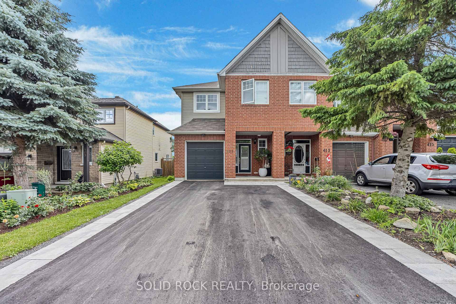 Welcome to 411 Cache Bay Crescent, a stunning 3 bed 3 bath END UNIT offering an elegant and well maintained home.