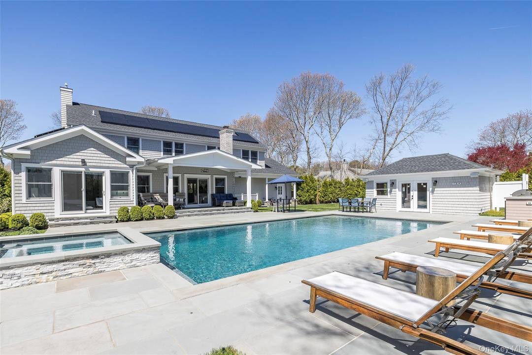 Set on a quiet and scenic street just minutes from Westhampton Beach Village and world renowned ocean beaches, this impeccably built new construction home offers an elevated Hamptons summer experience ...