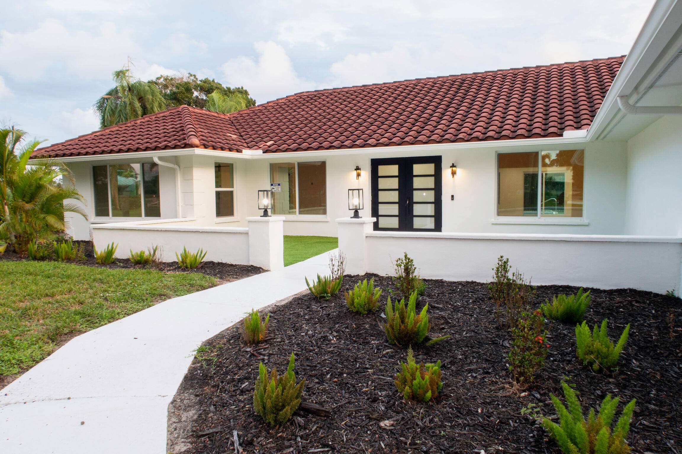 TURNKEY3 bed 3 bath CBS block home on a rare 1 acre lot with sweeping golf course views !