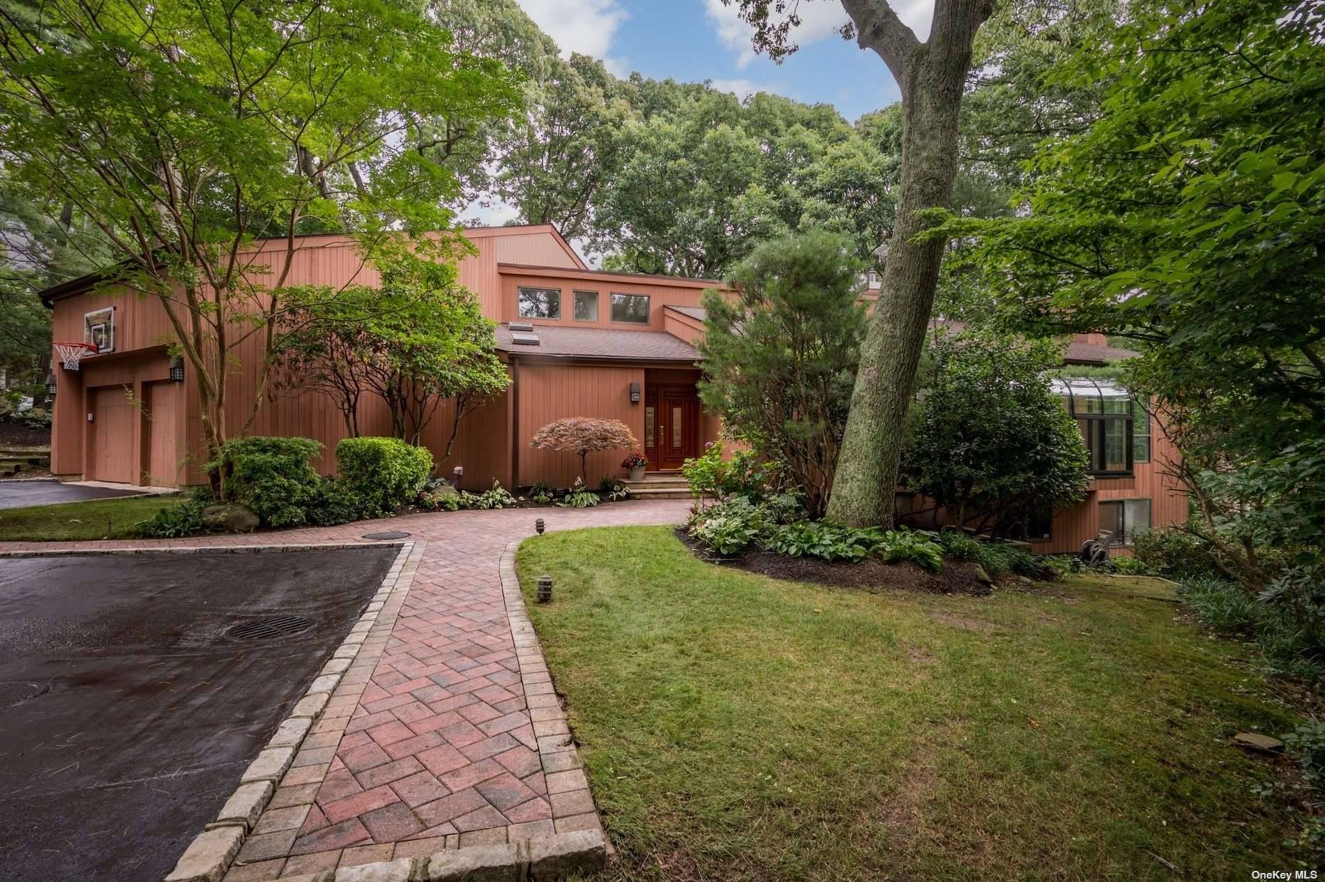 Introducing a hidden gem nestled in the private cul de sac of Corrigan Lane in Woodbury.