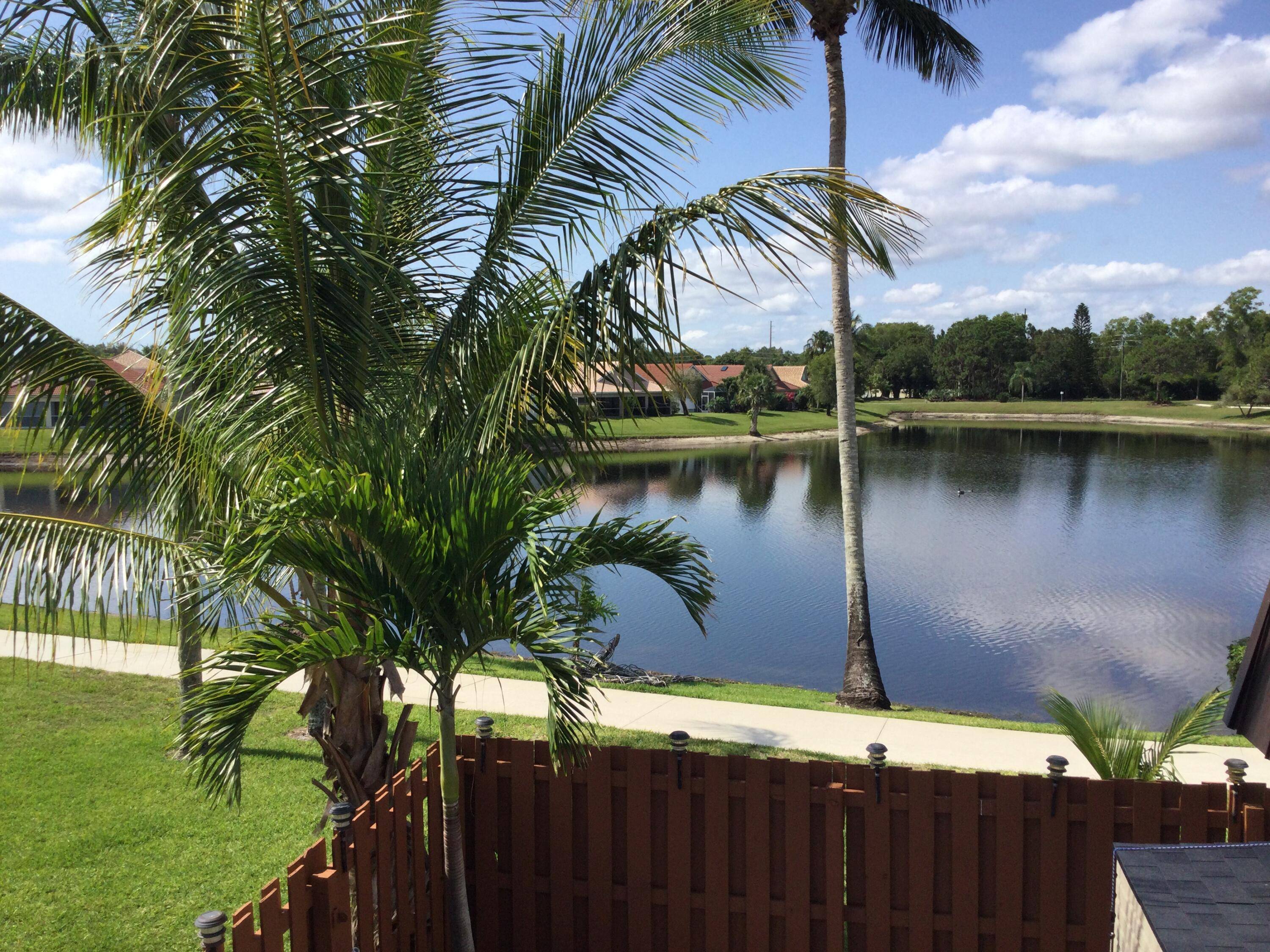 Welcome to this stunning Lakefront townhouse in the gated community of Emerald Lakes.