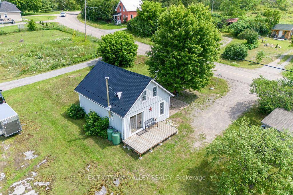 Discover the charm of this adorable cabin inspired home, ideal for those seeking a peaceful retreat or a lucrative investment opportunity.