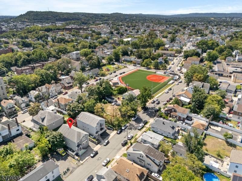 Experience refined modern living in this newer constructed two family residence, ideally located in Paterson just minutes from Haledon.
