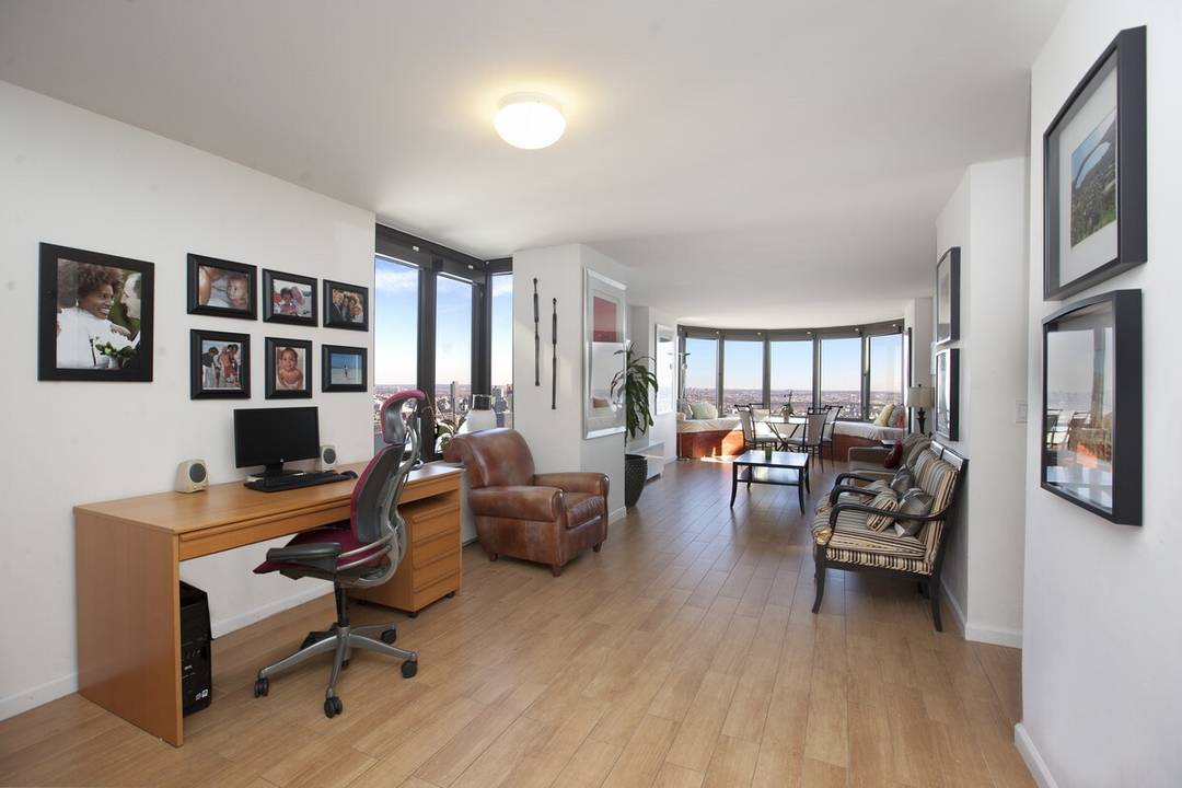 Experience both the sunrise and the sunset over the New York City skyline from the 56th floor of this spectacular 3 bedroom, 2 bath home.