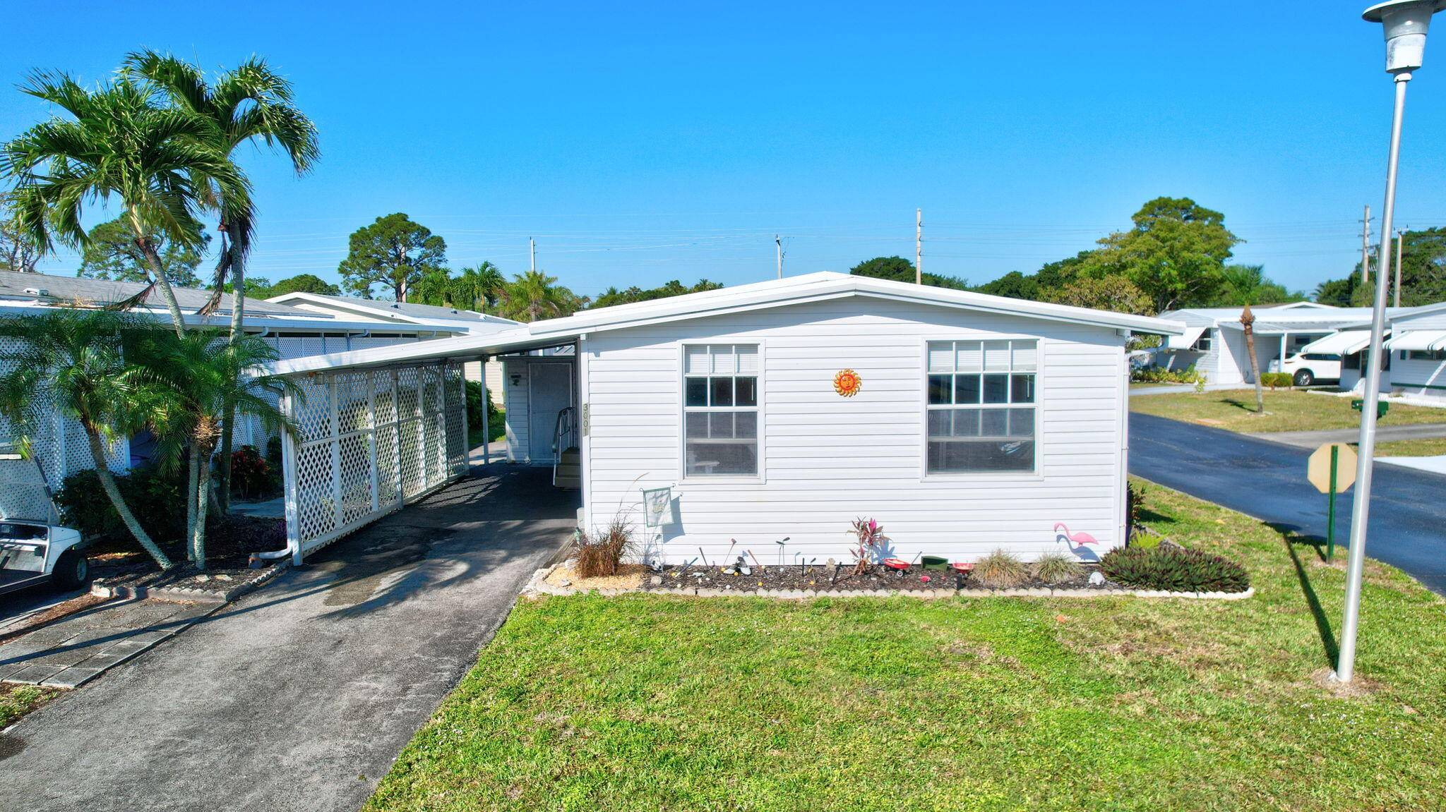 EXCELLENT VALUE ! Corner unit steps away from the clubhouse and multiple heated pools !