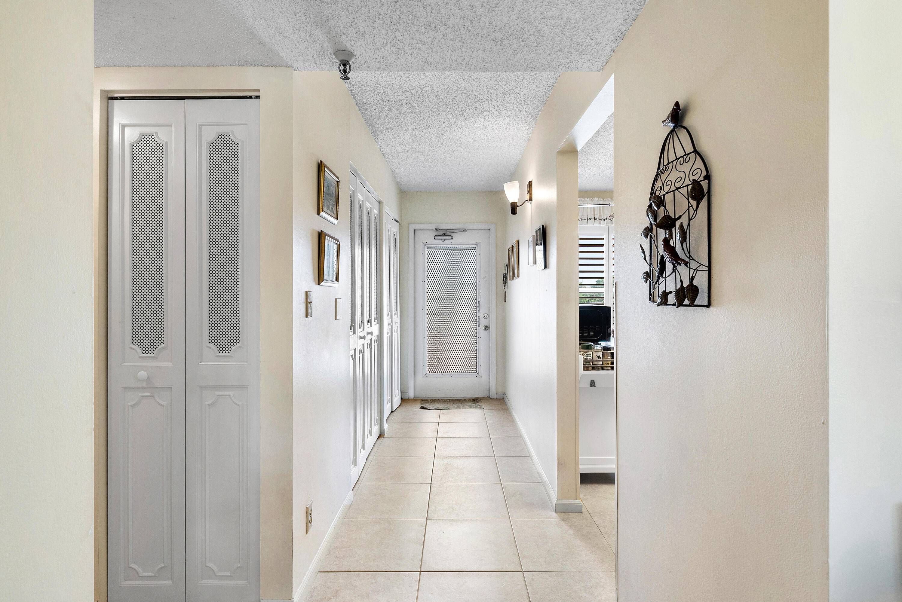 Lakefront Views ! Welcome to this charming residence in the highly desirable Villages of Oriole Adult Community.