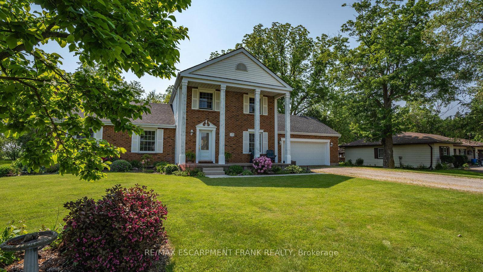 Welcome to 35 Blossom Ave, a meticulously kept home nestled up to the Grand River, with over 100 feet of waterfront and just over an acre of manicured property.
