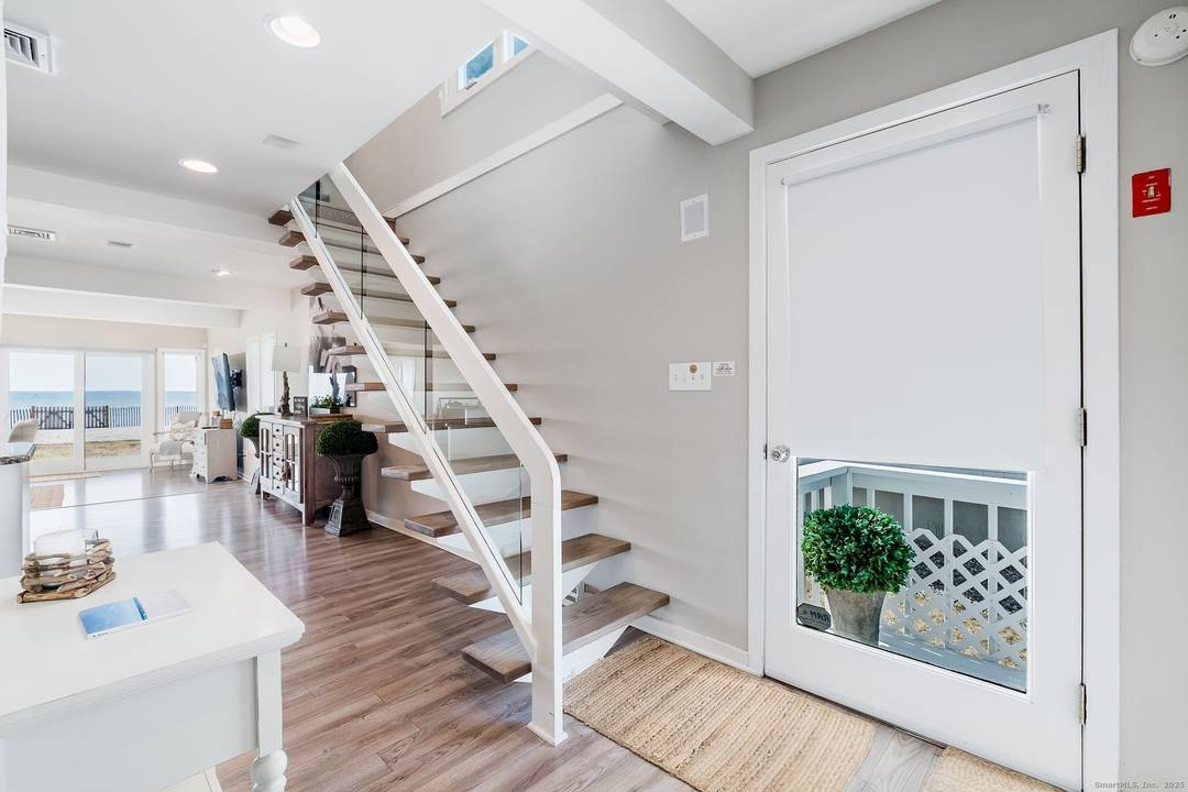 Beautifully renovated and refined, this elegant single family home is peacefully nestled in a private and tranquil section of Penfield Beach.