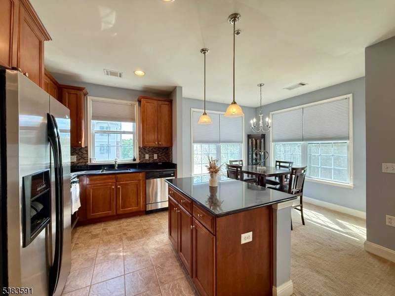 LIVE THE GRANDE LIFE ! Stunning 2 bedroom, 2 bath, 2nd floor Hickory Model with amazing views from every window !