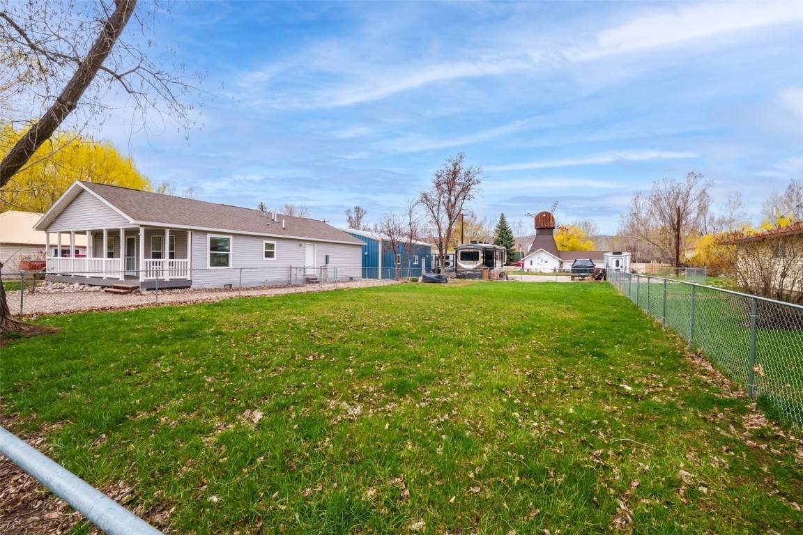 Brimming with possibilities, this property includes a fully furnished, turnkey home, 1200sf heated and insulated garage shop with interior office, plus a vacant buildable lot for a total of 1 ...