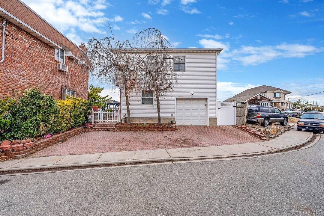 Step into the welcoming entry foyer of this 5 bedroom, 3 bath Hi Ranch with approximately 2, 100 square feet and serene canal views.