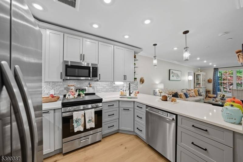 Experience easy living in this beautifully maintained second floor residence within the gated Fox Hill community.