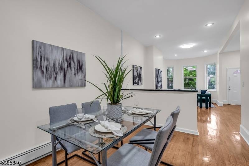 Welcome to 142 Sherman Avenue, a beautifully updated townhouse featuring 4 bedrooms, 2 full bathrooms, and 1 half bath.