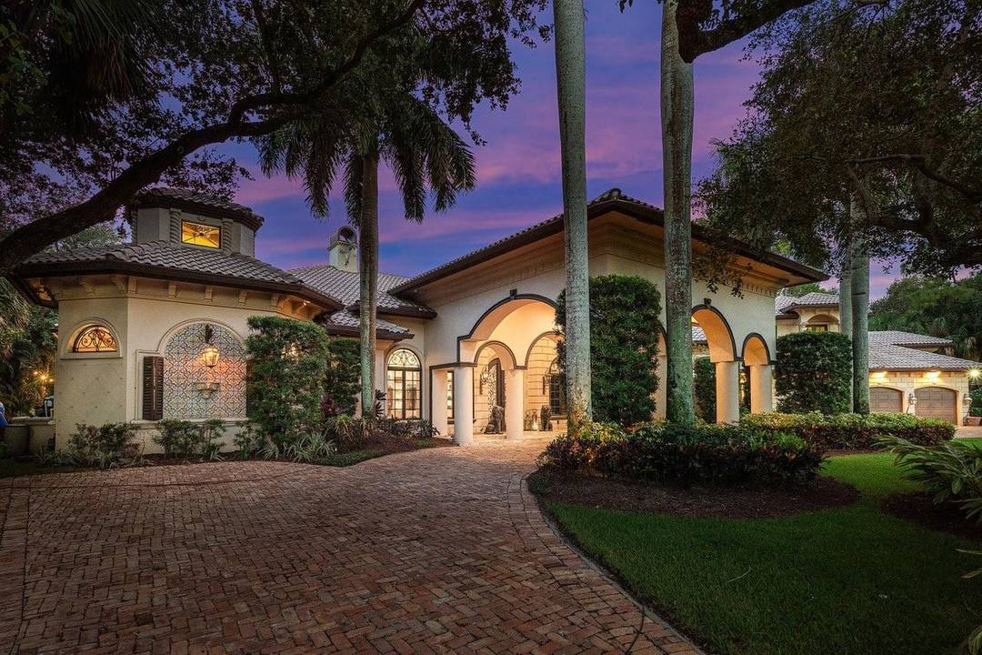 Welcome to 16389 Bridlewood Circle a timeless lakefront estate tucked behind the gates of one of Delray Beach s most exclusive enclaves, Foxe Chase.