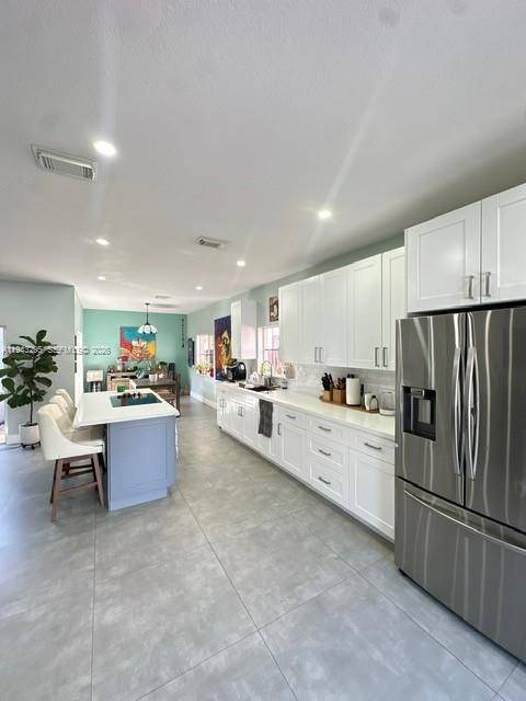 Beautifully maintained single family home situated on a desirable corner lot in the sought after Silver Palms community in Miami.