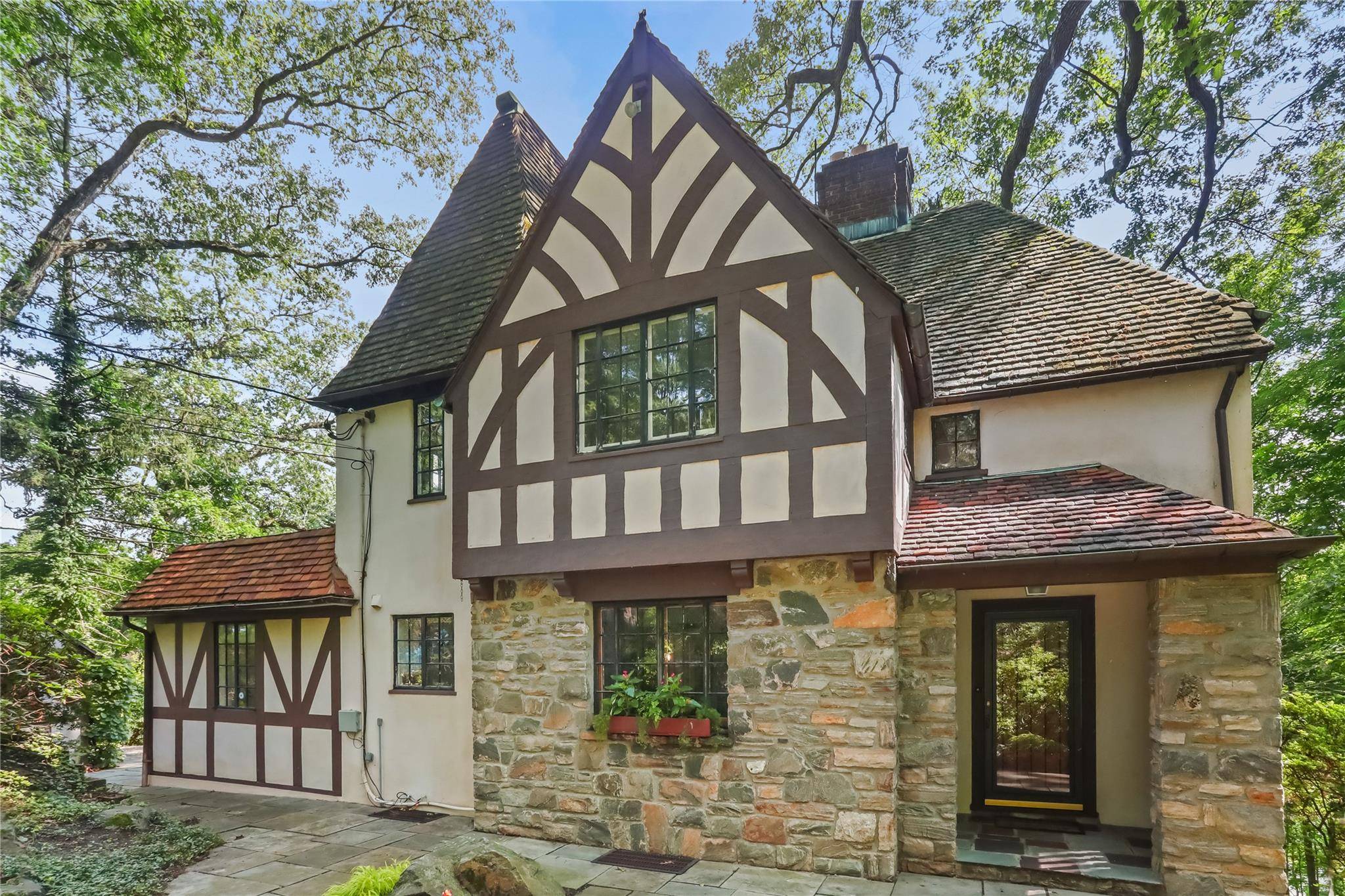 Nestled in a peaceful and private setting on two lots totaling 0.
