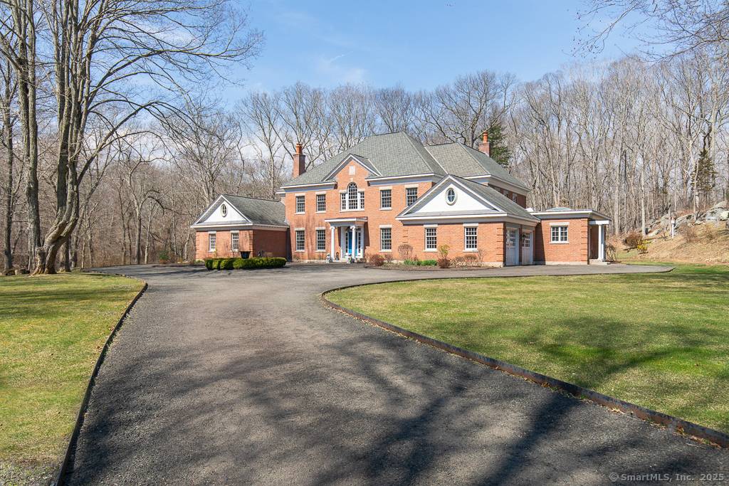 Come see this stately custom Brick English Georgian home in sought after Madison CT, nestled on a sprawling 5.