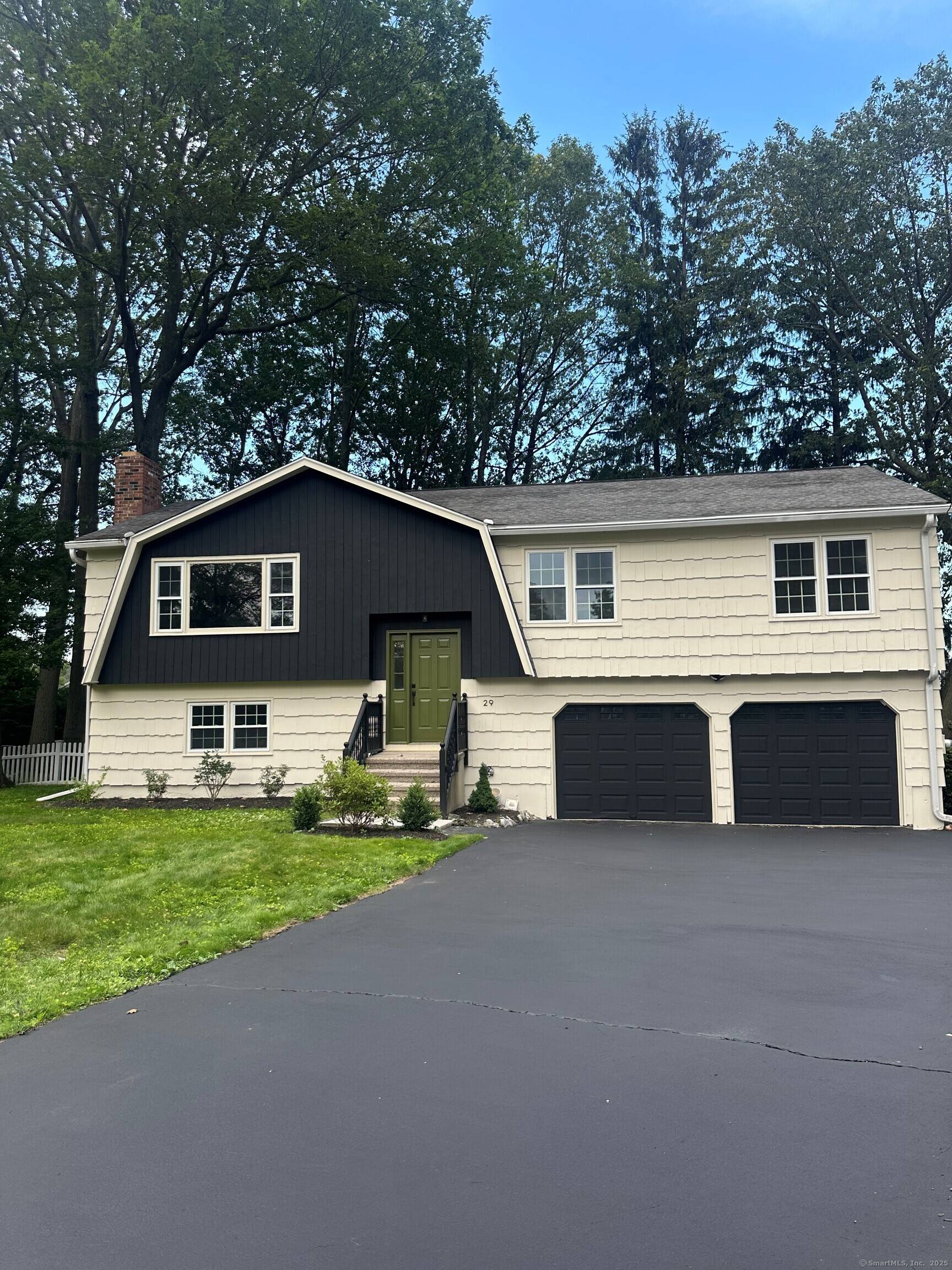 Step into luxury with this stunning raised ranch, nestled in a serene cul de sac between Walnut and Silver Sands Beach.