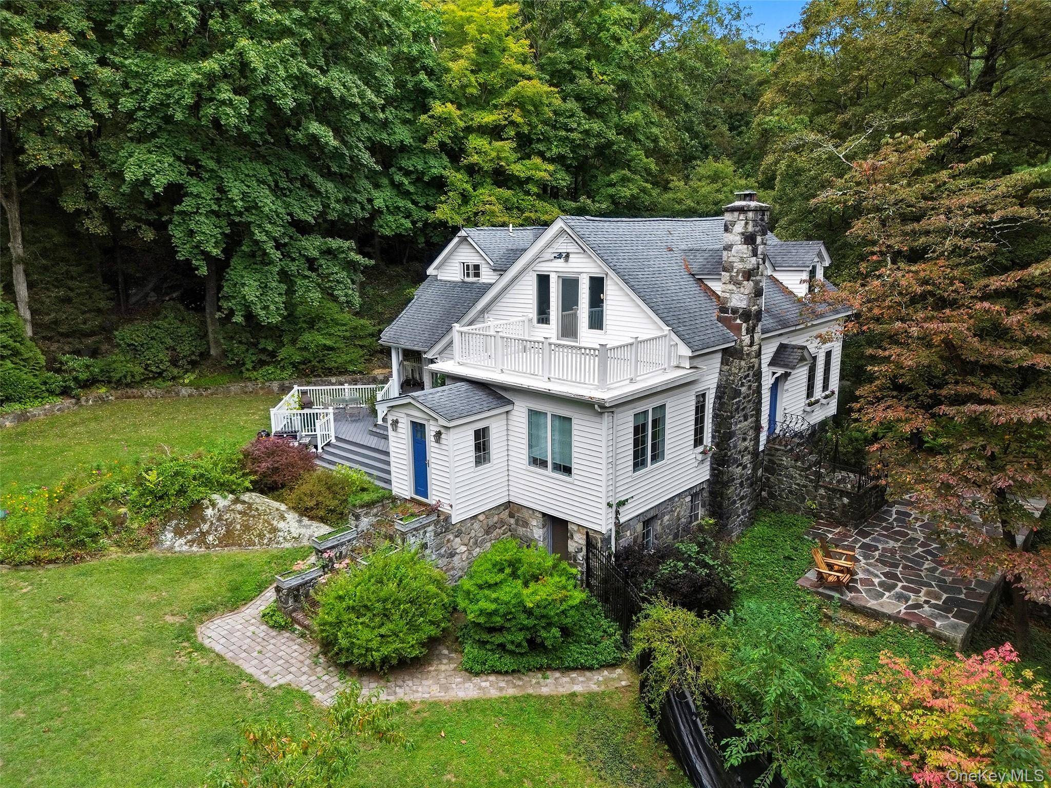 1930s Cape Cod Revival Colonial in the Lake Woodrock Community Your own private retreat nestled among mature trees, natural outcroppings, and a stones throw away from the lake with seasonal ...