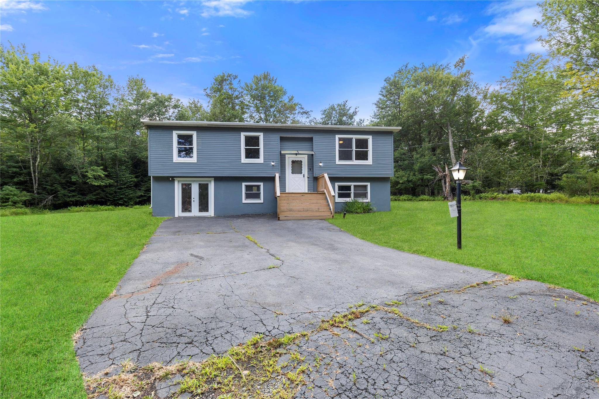 Welcome to this beautifully remodeled 4 bedroom, 2 bathroom home on nearly 3 acres of land, including an adjacent 1 acre lot.