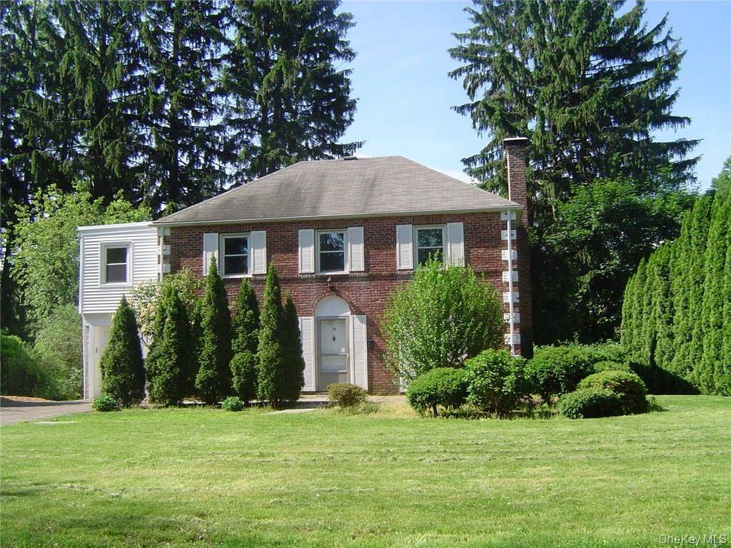Classic Brick Colonial in Sought After Strathmore Neighborhood on Tree lined Residential Street.
