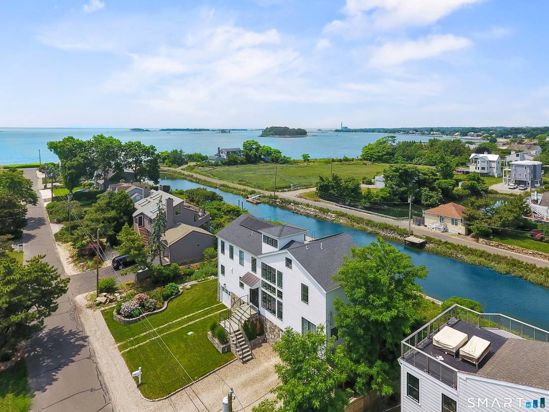 FEMA COMPLIANT and masterfully built in 2018, this extraordinary coastal residence at 24 Spriteview Avenue on Saugatuck Island offers an unrivaled waterfront lifestyle in one of Westport's most coveted enclaves.