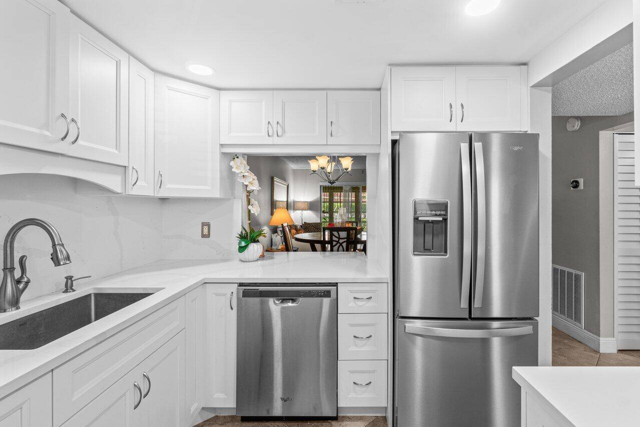 Corner first floor condo featuring 2 spacious bedrooms and 2 full bathrooms.