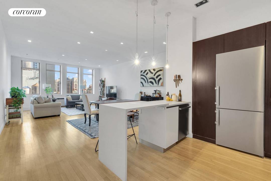 A stunning prewar CONDO loft in the famed Chelsea Mercantile featuring an open kitchen, primary bedroom suite, and an oversized den home office convertible to an interior BR with 2 ...