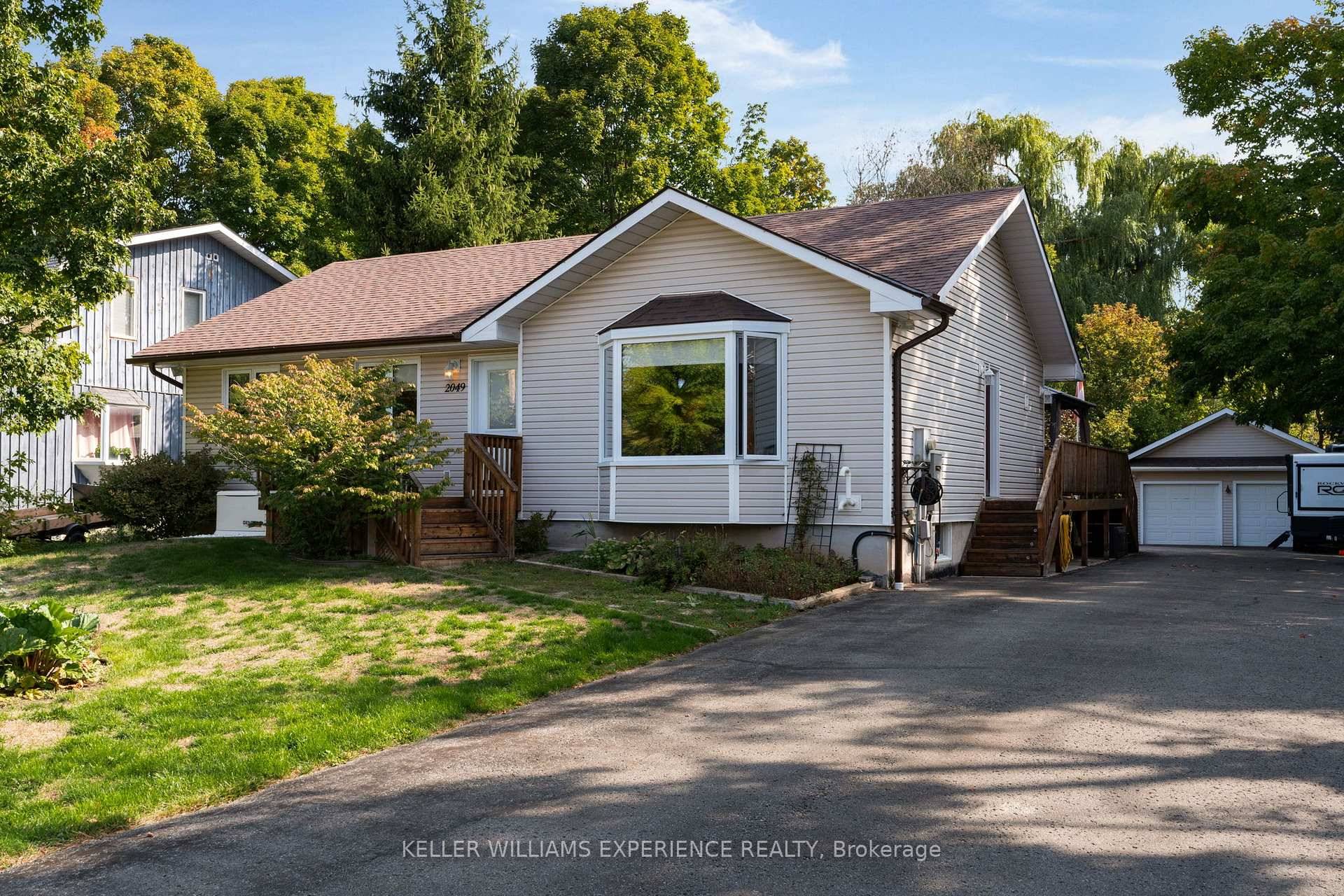 This inviting bungalow sits on a beautiful lot, complete with a separate heated garage that's perfect for year round storage, hobbies, or a workshop.