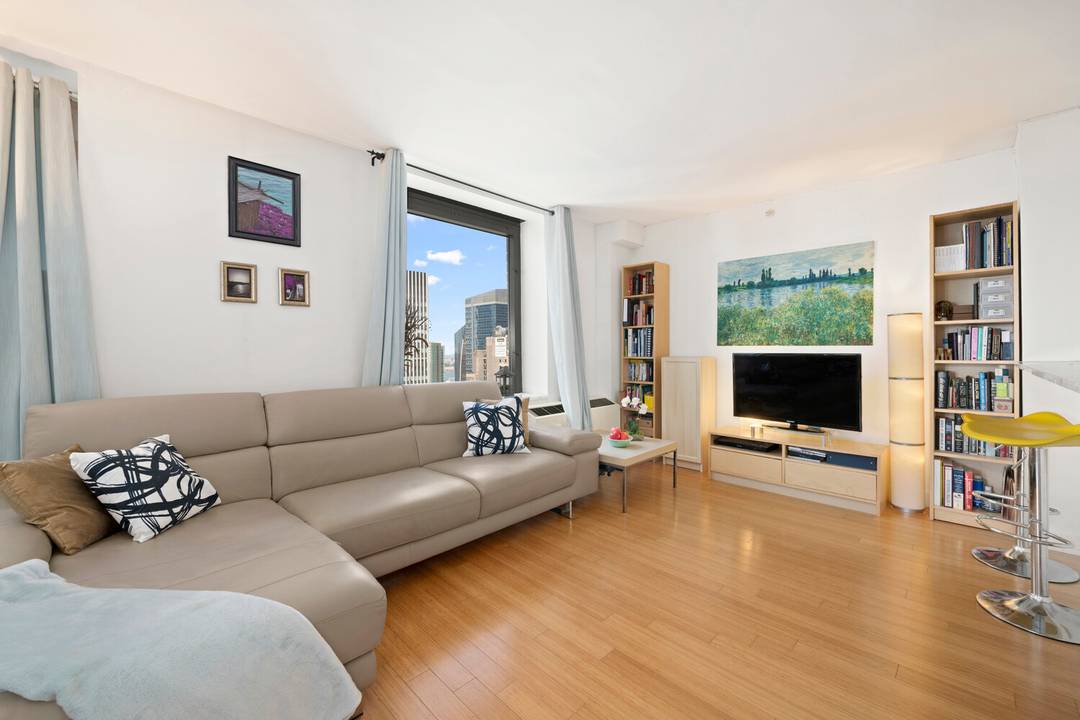 Wake up to postcard perfect views of the city from this modern Midtown condo.