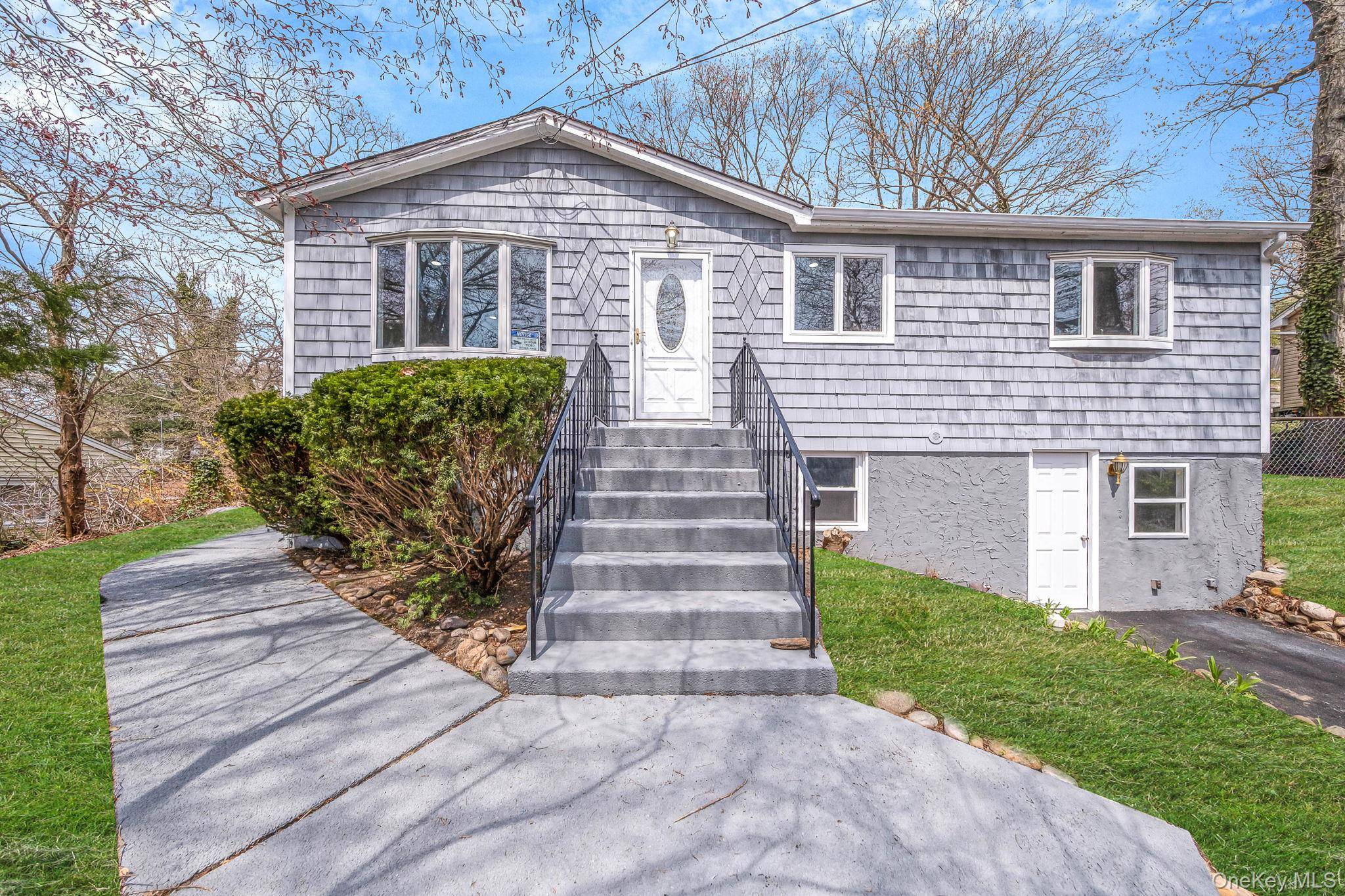 Stunningly Renovated Ranch on Quiet, Tree Lined Street in the Heart of Rocky Point.