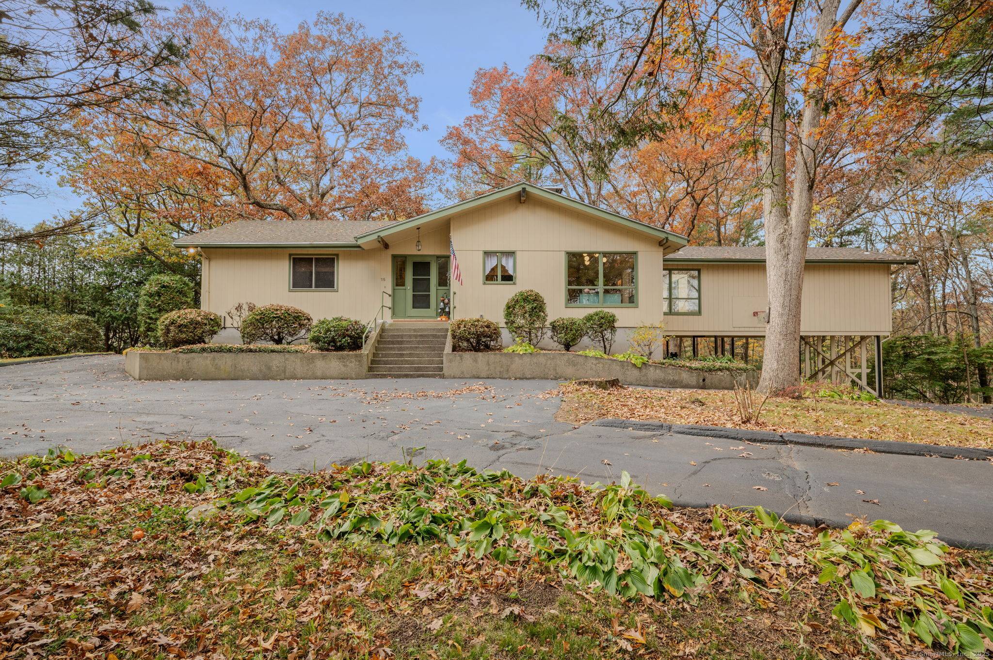 Tucked away at the end of a long private driveway, this beautifully secluded 3 bedroom, 2 bath home sits on just under an acre of peaceful, wooded land.