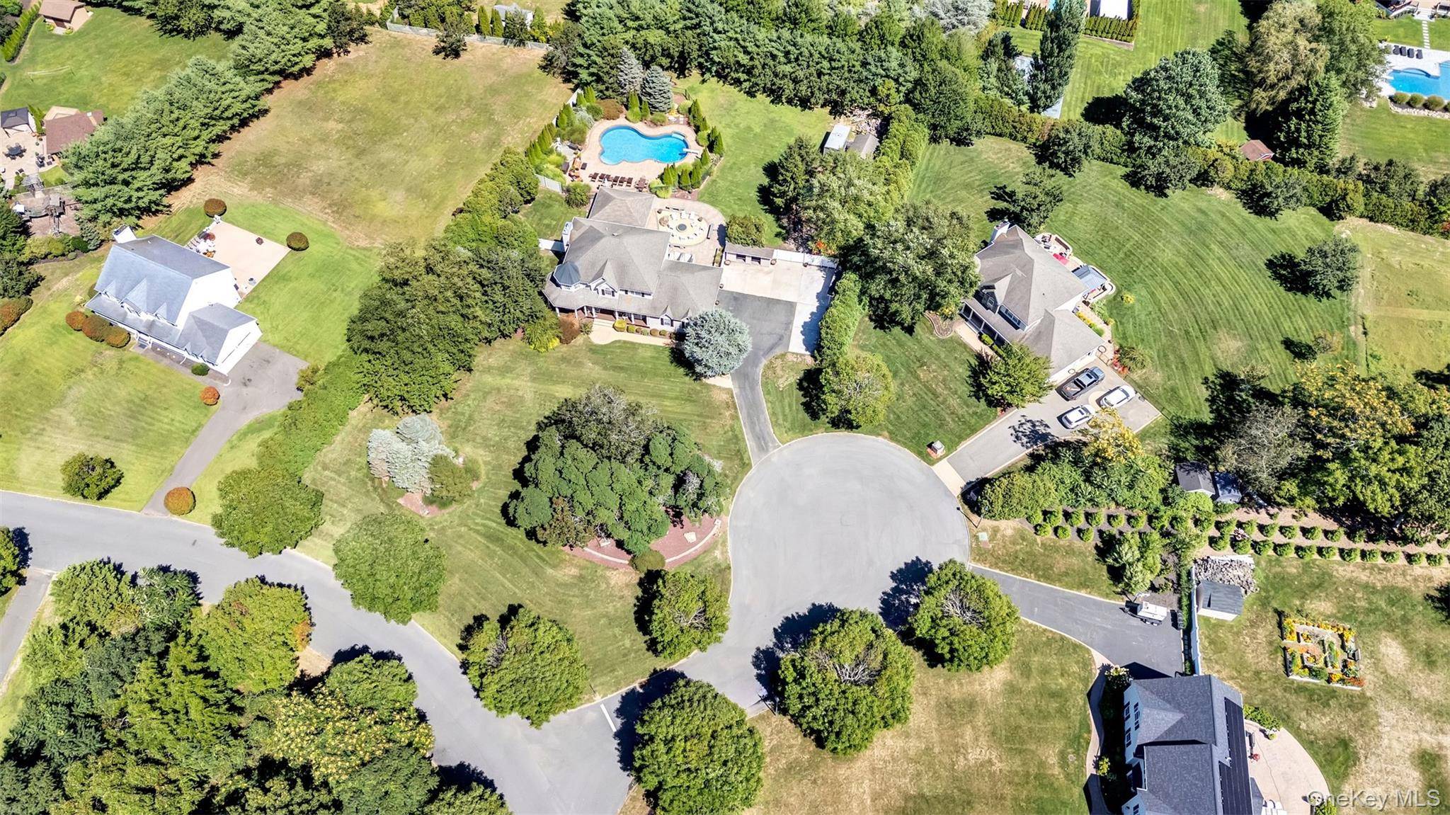 JUST REDUCED BY 100K ! ! Welcome Home to 2 Derby Court, Aquebogue, Elegance With Resort Like Surroundings !