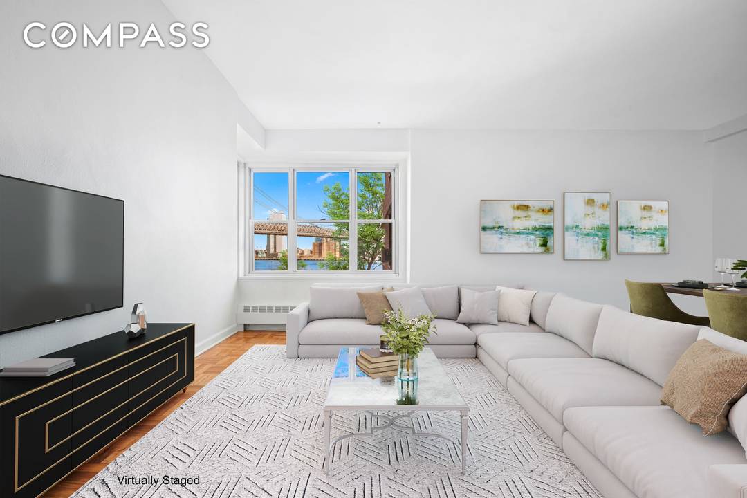 Welcome home to Residence B405 at 455 FDR Drive, a stunningly renovated three bedroom, two bathroom sanctuary offering breathtaking open views of the Williamsburg Bridge and the East River.