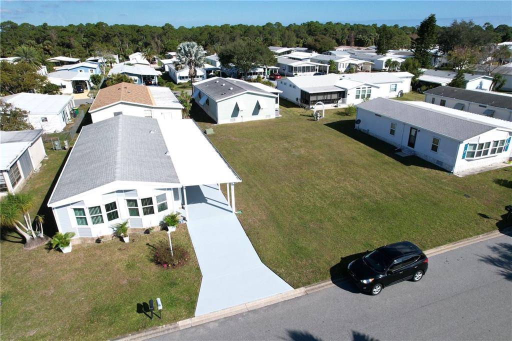 This TURN KEY, DOUBLE LOT, Basks in Barefoot Bay Sunshine all day long !