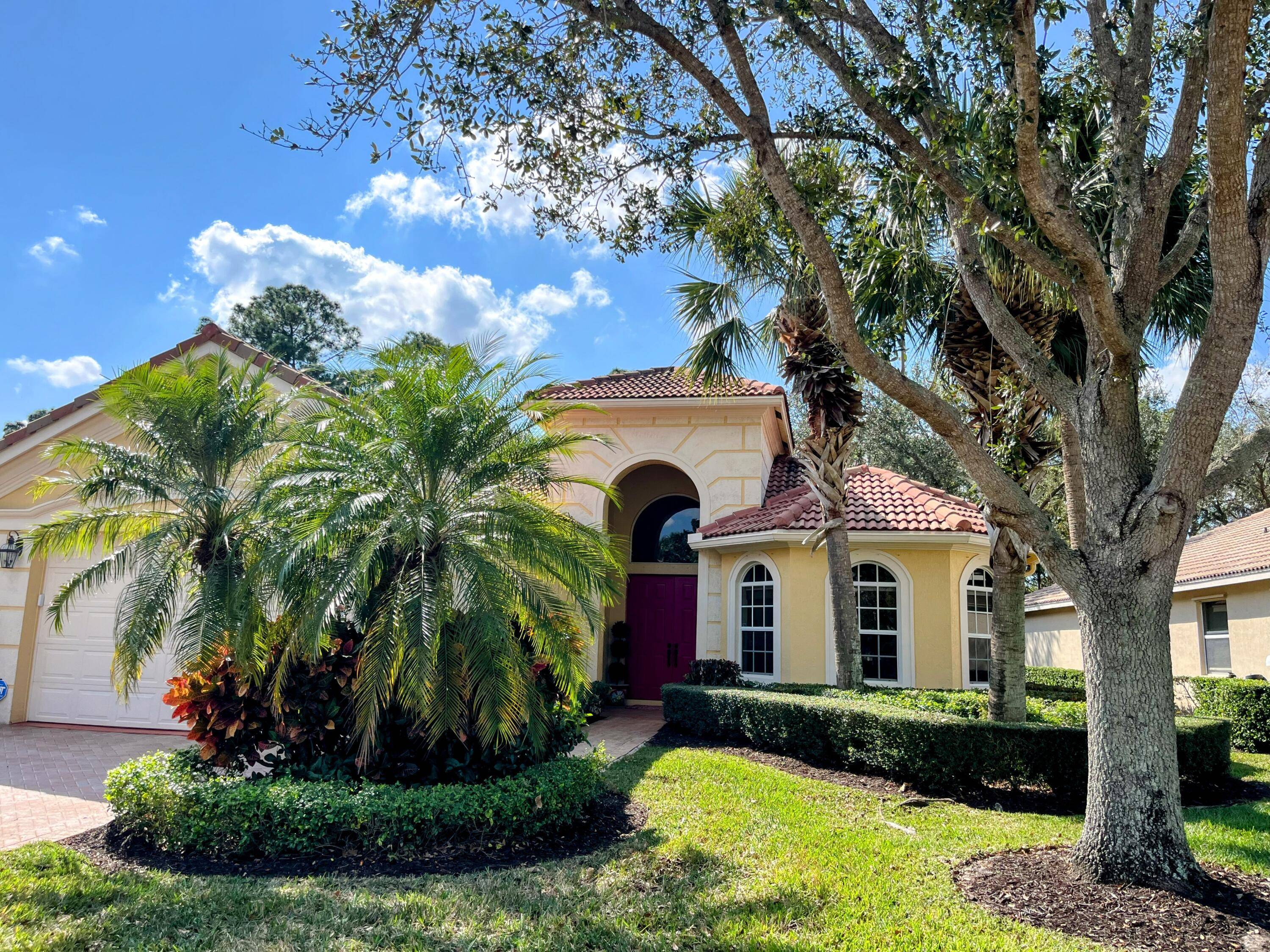 Welcome to 8821 Champions Way, a meticulously maintained home located in the prestigious PGA Village.