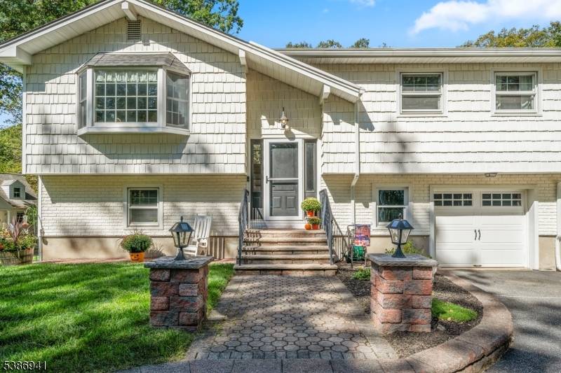 Pristine home with great curb appeal, nestled in popular Indian Lake with many attractive features !