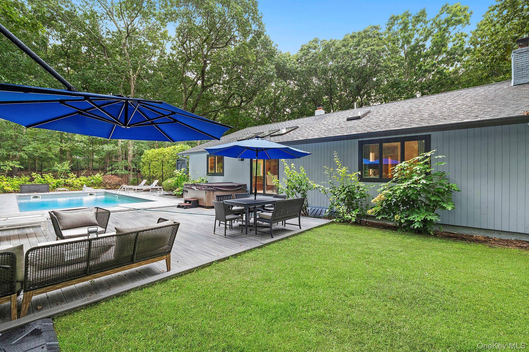 Welcome to an exquisite Sag Harbor retreat, perfectly situated on a quiet lane in the coveted Noyac area.