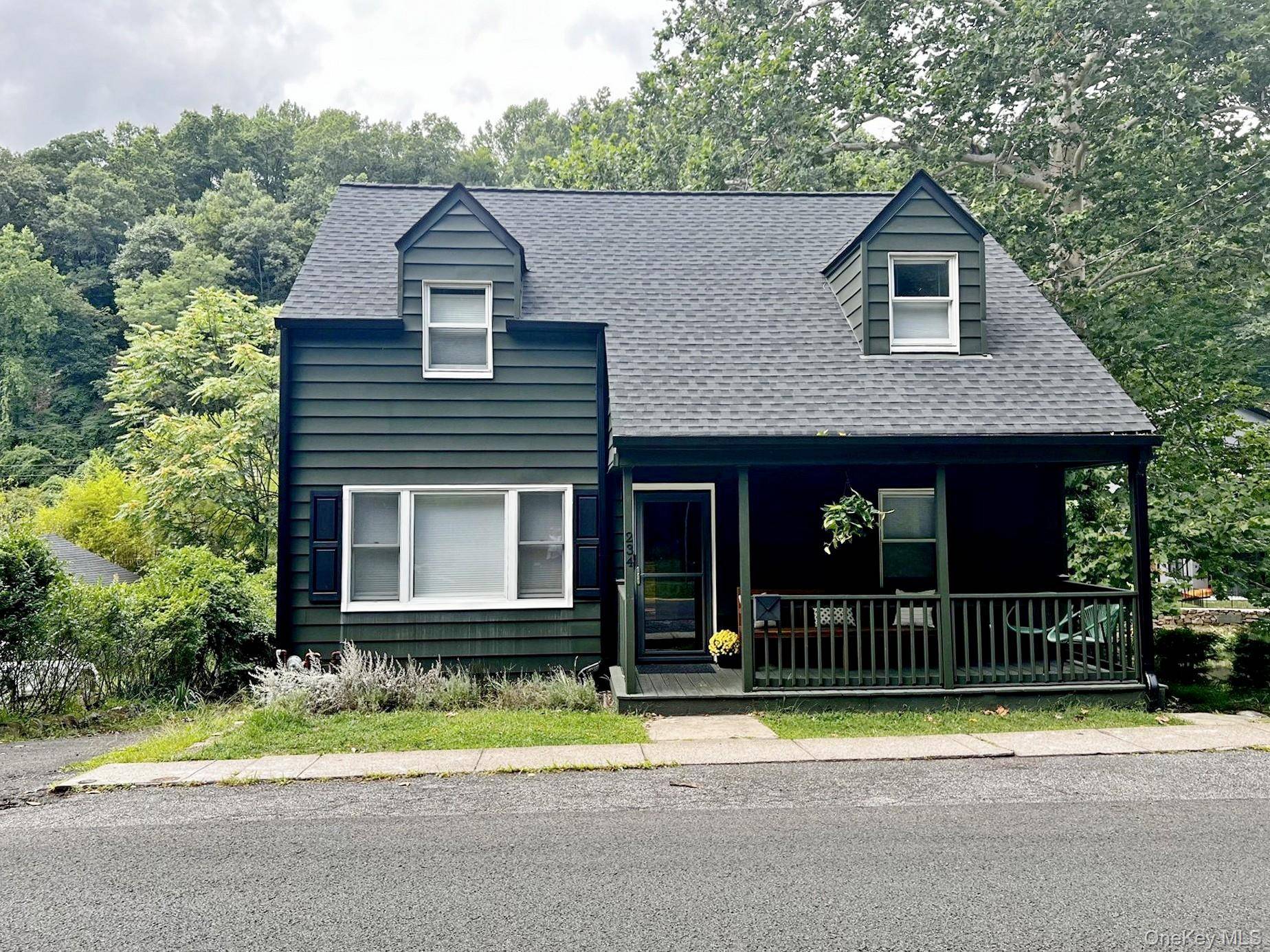 Nestled in the charming village of Piermont, this captivating three bedroom, two bathroom Cape Cod home offers an idyllic retreat overlooking Sparkill Creek.