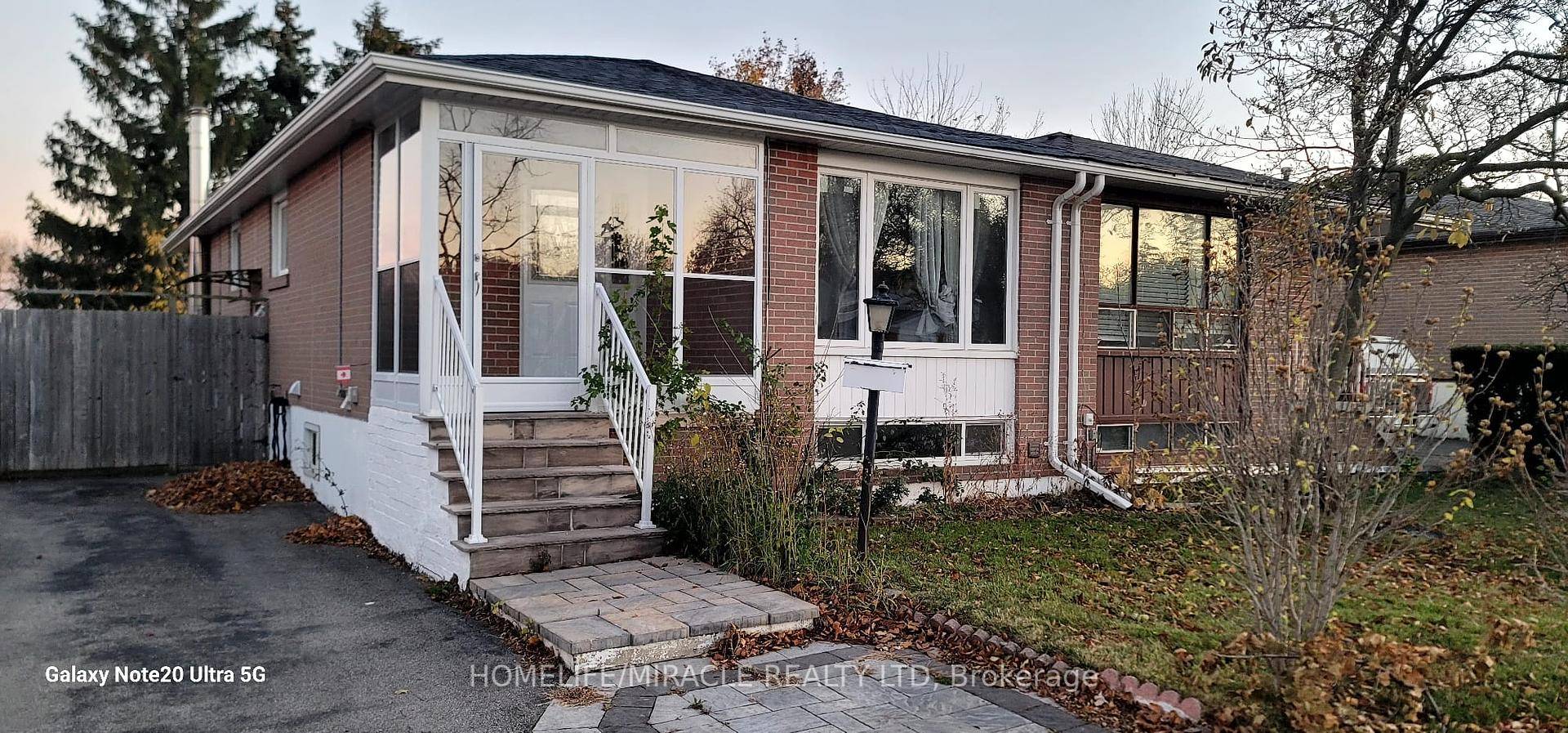 This Bright Beautiful Raised Bungalow Is Located In Clarkson Community.