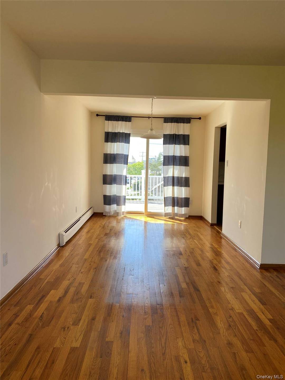 Sunny amp ; bright 3 bedroom apartment in a two family house with modern kitchen marble countertop, beautiful spacious living room with a porch.