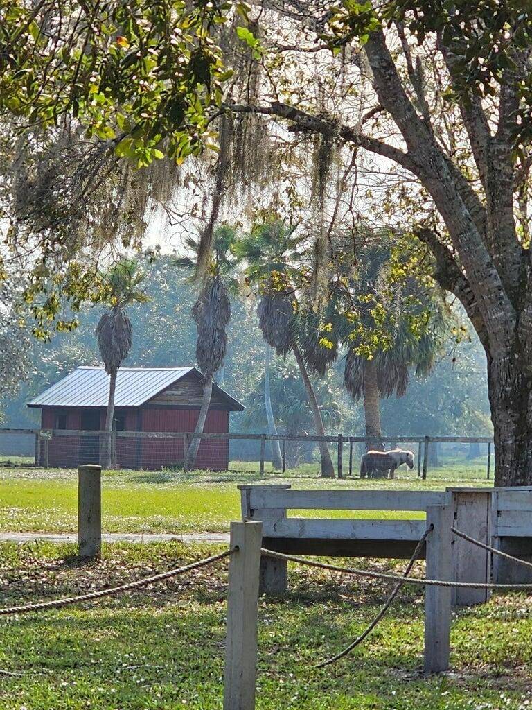 Must see this 20 acres Farm complex with angelic large oak trees featuring a main house 3 2 a Lodge with 5 guest studio suits.