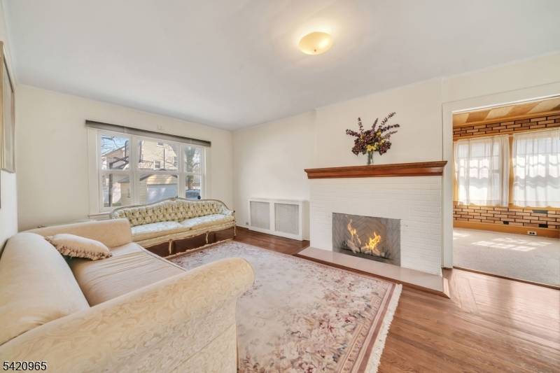 Experience the perfect blend of suburban comfort and urban accessibility in this spacious single family home located in the highly sought after Elmora section of Elizabeth, New Jersey.