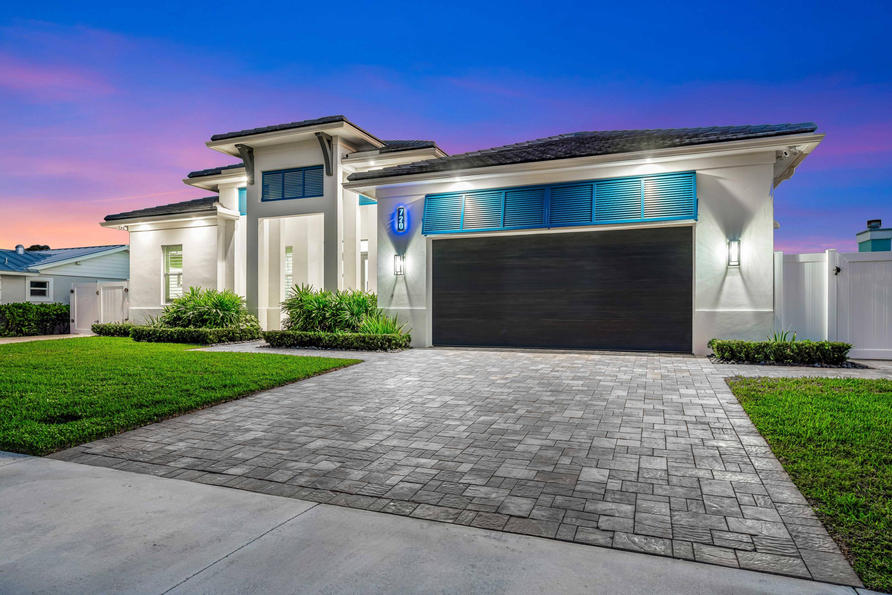 This stunning new construction 2022 waterfront home in North Palm Beach offers a luxurious coastal lifestyle.
