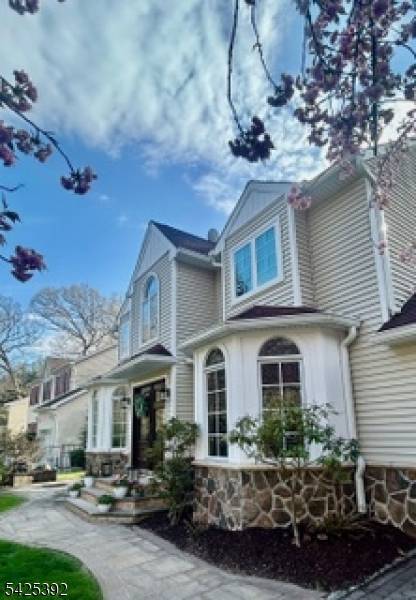 Refined Living with Direct Woodland Access in the Heart of Denville.