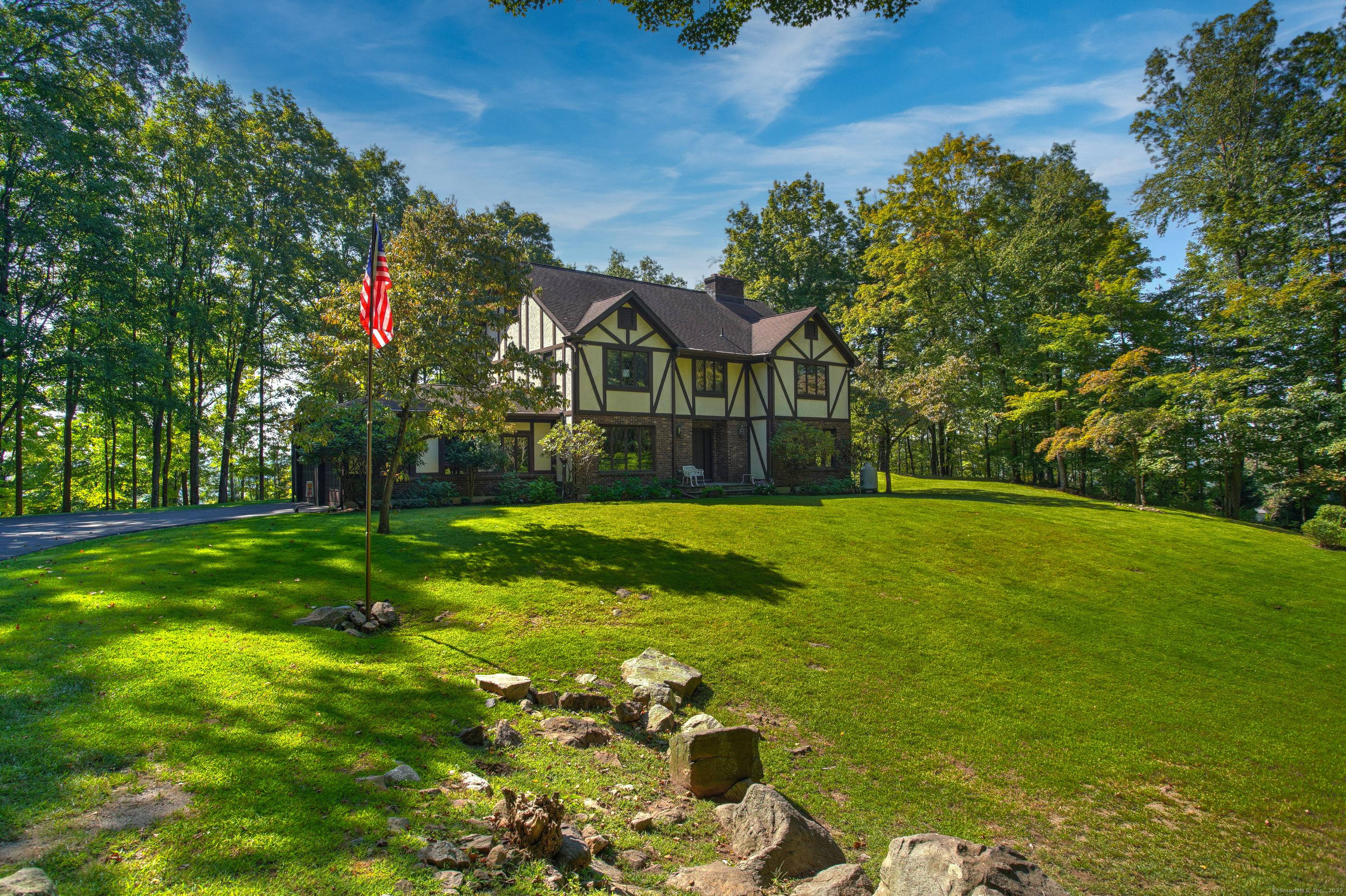 A rare opportunity to own this stately Tudor in one of the area's most distinguished subdivisions, Wintergreen Hill Estates.