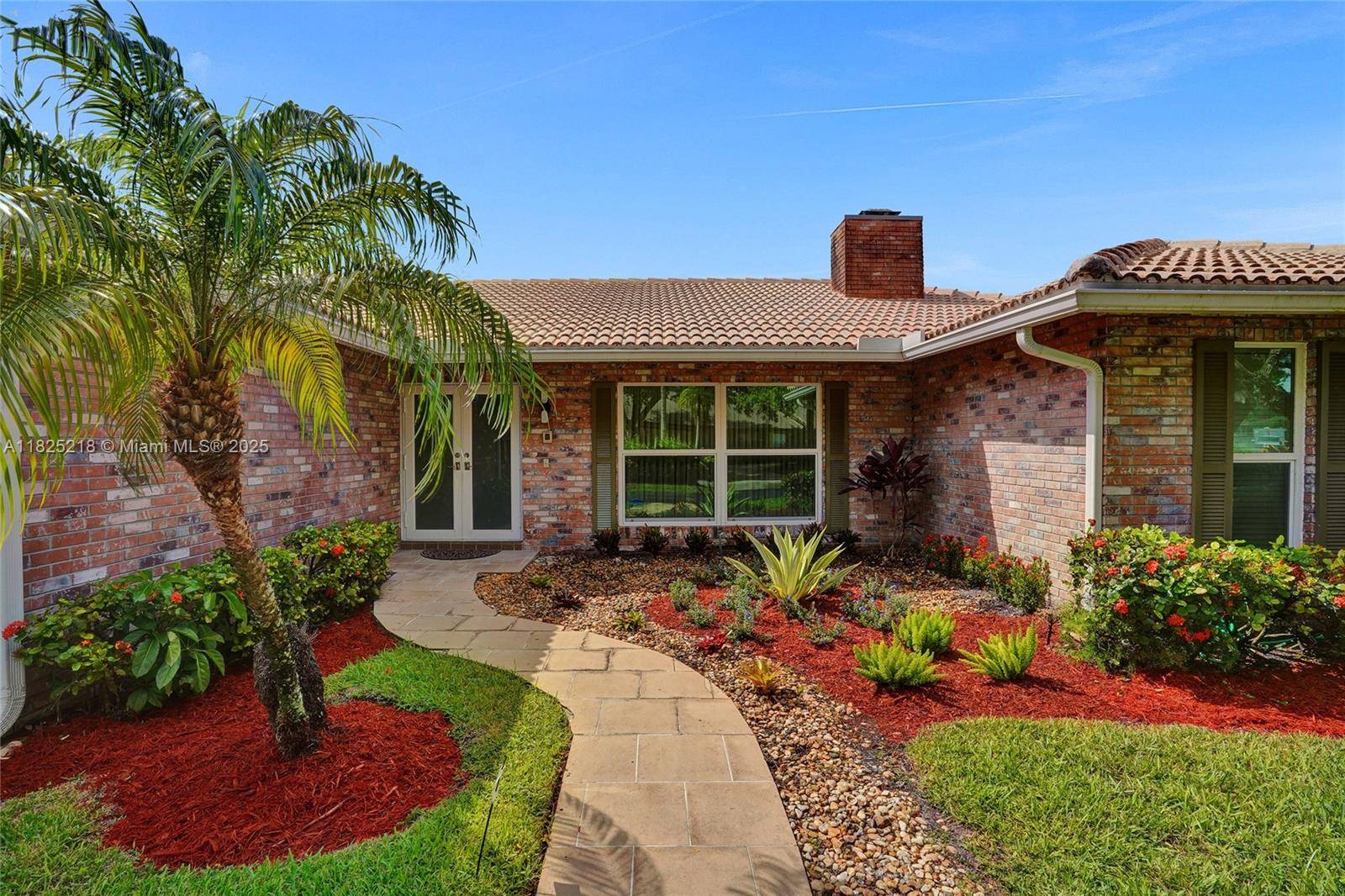 Vaulted ceilings accent open living spaces in the main living areas, built in bookcases flanking a fireplace !