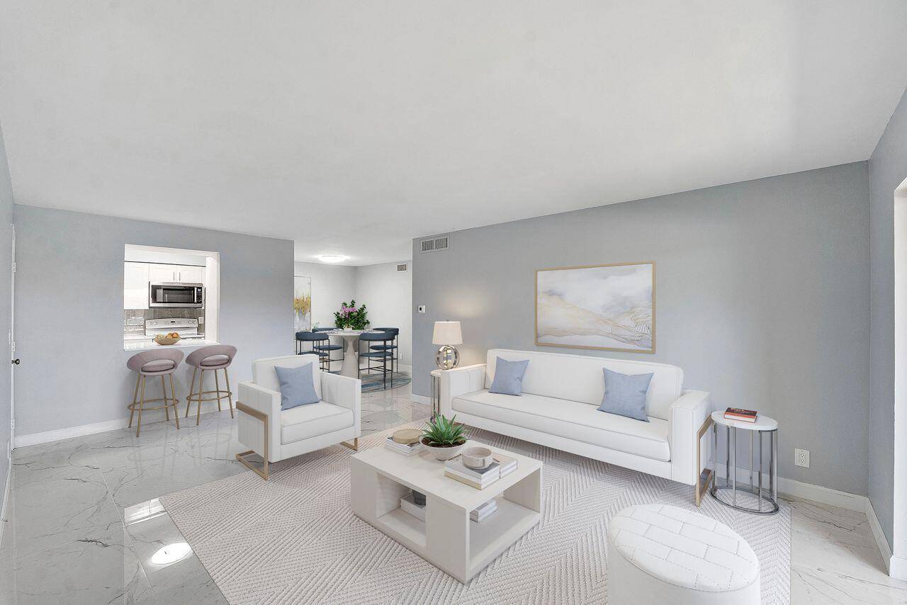 This fully remodeled 2 BR 2 BA ground floor condo with a full sized washer dryer is move in ready for the new buyers.